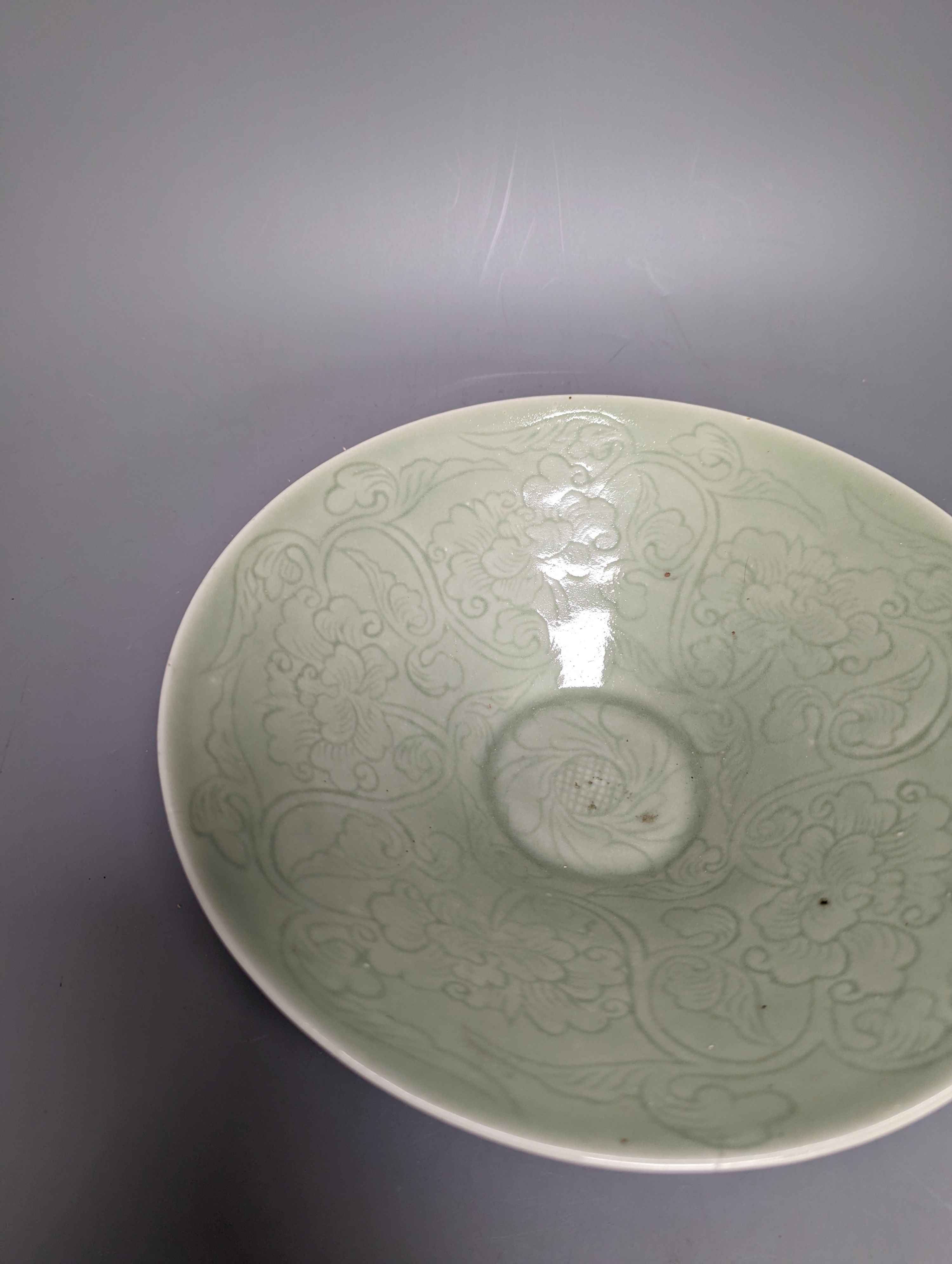 A 19th century Chinese sgraffito celadon glazed dish, diameter 26cm